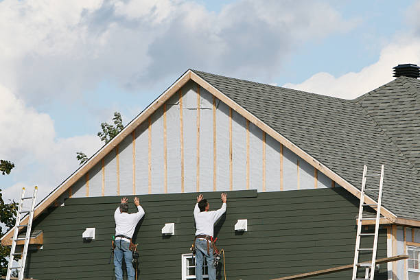 Professional Storm Damage Siding Repair technician working in Kent, OH